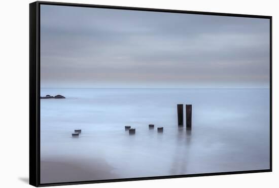 USA, New Jersey, Cape May National Seashore. Beach pilings on stormy sunrise.-Jaynes Gallery-Framed Stretched Canvas
