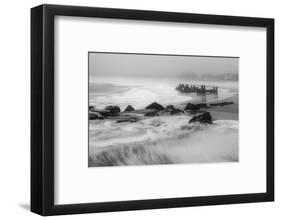 USA, New Jersey, Cape May National Seashore. Black and white of beach waves and old pier.-Jaynes Gallery-Framed Photographic Print