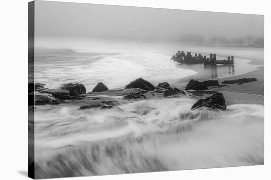 USA, New Jersey, Cape May National Seashore. Black and white of beach waves and old pier.-Jaynes Gallery-Stretched Canvas