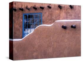 USA, New Mexico, Sant Fe, Adobe structure with protruding vigas and Snow-Terry Eggers-Stretched Canvas