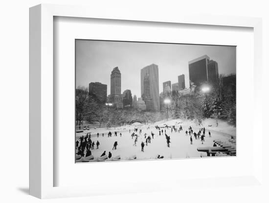 USA, New York, New York City, Skaters at the Wollman Rink-Walter Bibikow-Framed Photographic Print
