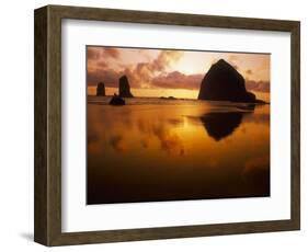 USA, Oregon, Cannon Beach Haystack Rock silhouetted at sunset.-Stuart Westmorland-Framed Photographic Print