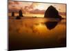 USA, Oregon, Cannon Beach Haystack Rock silhouetted at sunset.-Stuart Westmorland-Mounted Photographic Print
