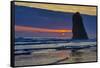 USA, Oregon, Cannon Beach. Sunset on Lone Seastack-Jean Carter-Framed Stretched Canvas