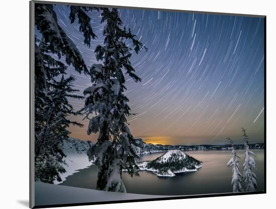 USA, Oregon, Crater Lake National Park. Star trails over Crater Lake and Wizard Island in winter.-Yuri Choufour-Mounted Photographic Print