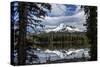 USA, Oregon, Deschutes National Forest. Broken Top framed by conifers and reflected by Sparks Lake.-Mark Williford-Stretched Canvas