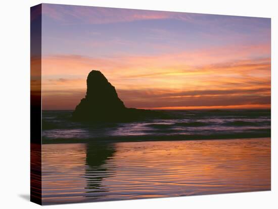 USA, Oregon. Ecola State Park, sunset over sea stack at Indian Beach.-John Barger-Stretched Canvas