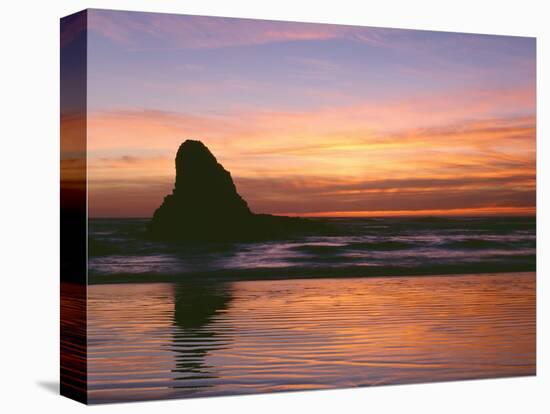 USA, Oregon. Ecola State Park, sunset over sea stack at Indian Beach.-John Barger-Stretched Canvas