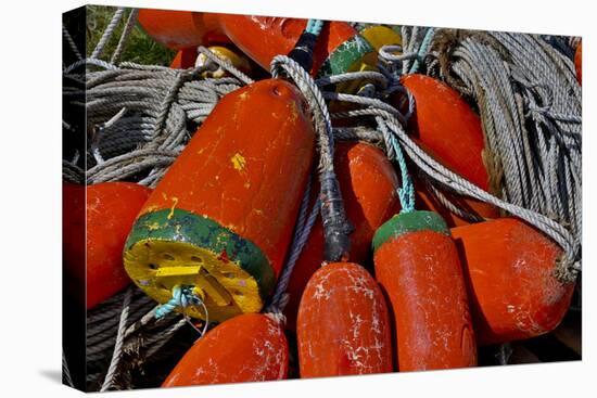 USA, Oregon, Garibaldi. Colorful Crab Pot Buoys-Jean Carter-Stretched Canvas