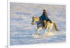USA, Shell, Wyoming. Hideout Ranch cowgirl riding her horse in the snow. (PR,MR)-Darrell Gulin-Framed Photographic Print