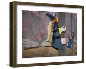 USA, Utah, Moab, Halloween witch on broomstick that crashed into pole.-Merrill Images-Framed Photographic Print