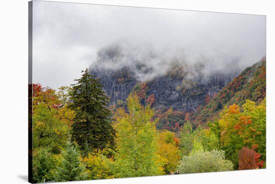 USA, Vermont, New England, Stowe Mt. Mansfield parking lot view with fog on mountains-Alison Jones-Stretched Canvas