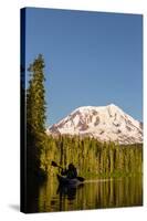 USA, WA. Woman kayaker paddles on calm, scenic Takhlakh Lake with Mt. Adams in the background.-Gary Luhm-Stretched Canvas