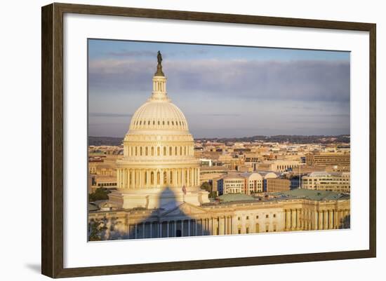 USA, Washington DC. Sunrise over the U.S. Capitol building and city.-Christopher Reed-Framed Photographic Print