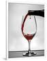 USA, Washington, Spokane. Red wine poured into wine glass creates perfect round drop,-Richard Duval-Framed Photographic Print