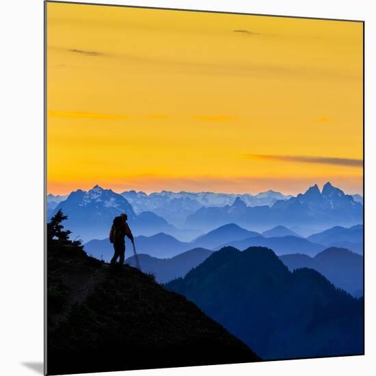 USA, Washington State. A backpacker descending from the Skyline Divide at sunset.-Gary Luhm-Mounted Photographic Print