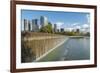 USA, Washington State, Bellevue. Pond and waterfall at Downtown Park, with skyline.-Merrill Images-Framed Photographic Print