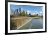 USA, Washington State, Bellevue. Pond and waterfall at Downtown Park, with skyline.-Merrill Images-Framed Photographic Print