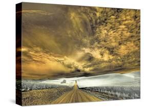 USA, Washington State, Palouse. Backcountry road through wheat field and clouds-Terry Eggers-Stretched Canvas