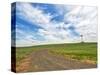 USA, Washington State, Palouse. Field road leading to weather vane-Terry Eggers-Stretched Canvas