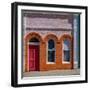 USA, Washington State, Pomeroy. Colorful old building with arched windows and doorway with scale-Sylvia Gulin-Framed Photographic Print