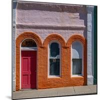 USA, Washington State, Pomeroy. Colorful old building with arched windows and doorway with scale-Sylvia Gulin-Mounted Photographic Print