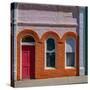 USA, Washington State, Pomeroy. Colorful old building with arched windows and doorway with scale-Sylvia Gulin-Stretched Canvas