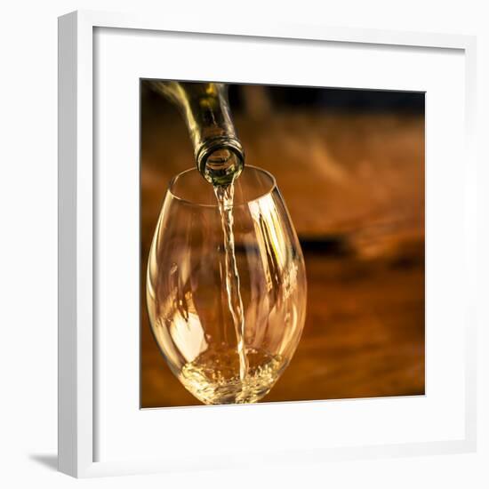 USA, Washington State, Seattle. White wine pouring into glass in a Seattle winery.-Richard Duval-Framed Premium Photographic Print