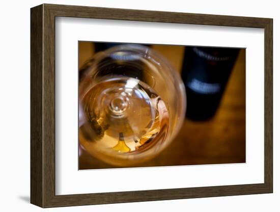 USA, Washington State, Seattle. Wine bottles are reflected in a glass of L'Orange, a Pinot Gris mad-Richard Duval-Framed Photographic Print