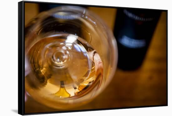 USA, Washington State, Seattle. Wine bottles are reflected in a glass of L'Orange, a Pinot Gris mad-Richard Duval-Framed Stretched Canvas