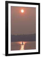 USA, Washington State. Two people in sailboat. Smoky skies from wildfires create eerie sunset-Trish Drury-Framed Photographic Print