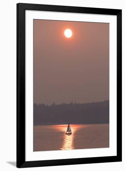 USA, Washington State. Two people in sailboat. Smoky skies from wildfires create eerie sunset-Trish Drury-Framed Photographic Print