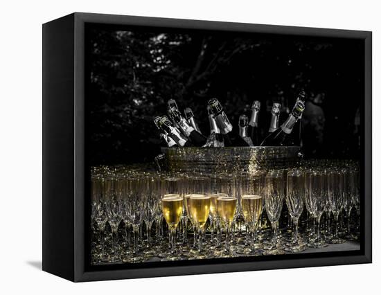 USA, Washington, Woodinville. Sparkling wine bottles and glasses ready for tasting at a wine event.-Richard Duval-Framed Stretched Canvas