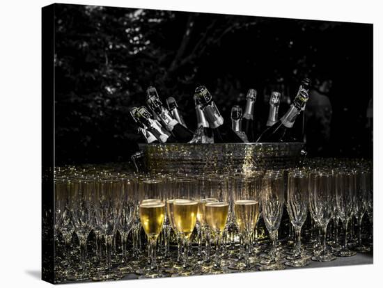 USA, Washington, Woodinville. Sparkling wine bottles and glasses ready for tasting at a wine event.-Richard Duval-Stretched Canvas