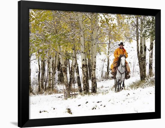 USA, Wyoming, Shell, Big Horn Mountains, Cowboys riding through with fresh snowfall-Terry Eggers-Framed Photographic Print