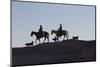 USA, Wyoming, Shell, The Hideout Ranch, Cowboys, Horses and Dogs in Early Light-Hollice Looney-Mounted Photographic Print