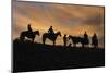 Usa, Wyoming, Shell, The Hideout Ranch, Cowboys in Silhouette at Sunset-Hollice-Mounted Photographic Print