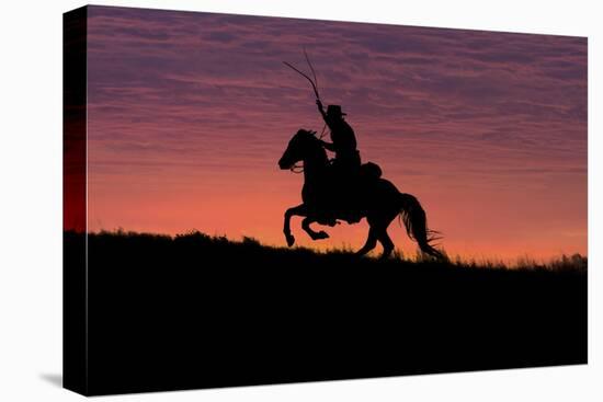 USA, Wyoming, Shell, The Hideout Ranch, Silhouette of Cowboy and Horse at Sunset-Hollice Looney-Stretched Canvas