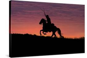 USA, Wyoming, Shell, The Hideout Ranch, Silhouette of Cowboy and Horse at Sunset-Hollice Looney-Stretched Canvas