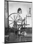Using a Spinning Wheel-null-Mounted Photographic Print