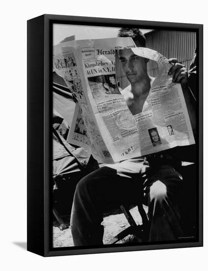 USMC Pfc Ronald M. Clarke Attempting to Read Heavily Censored New York Herald Tribune in Lebanon-Hank Walker-Framed Stretched Canvas
