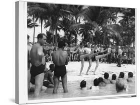 USO Chorus Girls Doing High-Kicks in Swimsuits During Impromptu Song and Dance on Beach-Peter Stackpole-Stretched Canvas