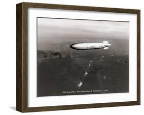 USS Macon over the Golden Gate and Pacific Fleet, 1934-Clyde Sunderland-Framed Art Print