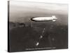 USS Macon over the Golden Gate and Pacific Fleet, 1934-Clyde Sunderland-Stretched Canvas