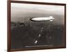 USS Macon over the Golden Gate and Pacific Fleet, 1934-Clyde Sunderland-Framed Art Print