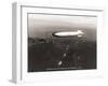 USS Macon over the Golden Gate and Pacific Fleet, 1934-Clyde Sunderland-Framed Art Print