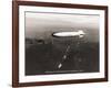 USS Macon over the Golden Gate and Pacific Fleet, 1934-Clyde Sunderland-Framed Art Print