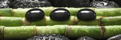 Black Stones on Bamboo-Uwe Merkel-Photographic Print