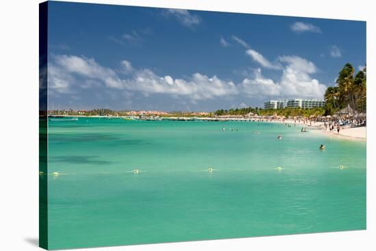 Vacationers along Palm Beach in Aruba-raphoto-Stretched Canvas