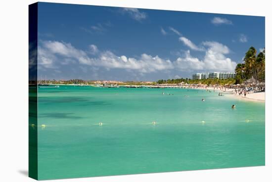 Vacationers along Palm Beach in Aruba-raphoto-Stretched Canvas